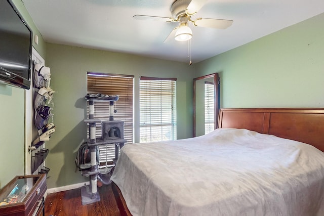 bedroom featuring dark hardwood / wood-style floors and ceiling fan