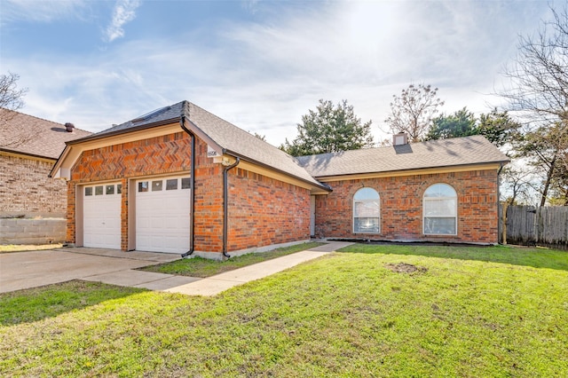 ranch-style home with a front yard and a garage