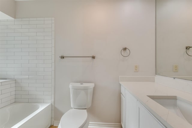 bathroom featuring toilet and vanity