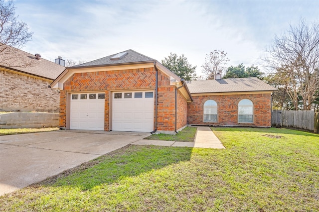 view of front of house with a garage and a front lawn