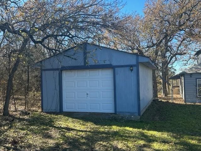 garage featuring a yard