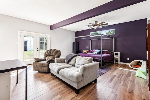 bedroom featuring access to exterior, beam ceiling, multiple windows, and ceiling fan