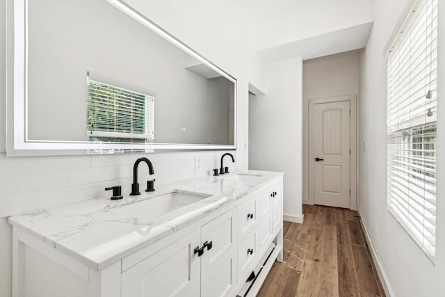 bathroom featuring vanity and wood-type flooring