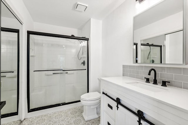 bathroom with walk in shower, decorative backsplash, vanity, and toilet