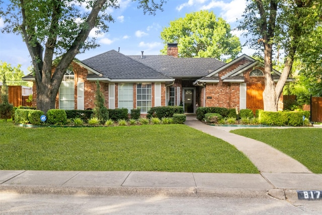 ranch-style house featuring a front lawn