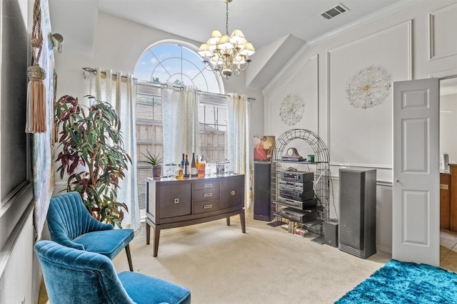 sitting room with a chandelier and light carpet