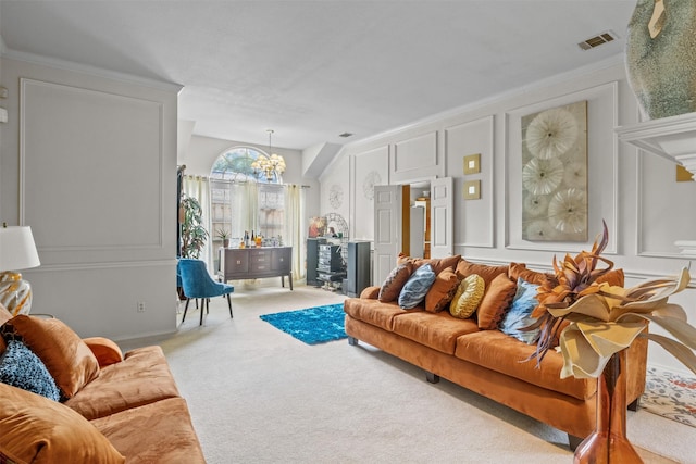 carpeted living room featuring ornamental molding and a notable chandelier