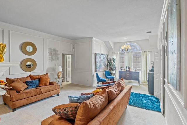 living room featuring an inviting chandelier and light colored carpet