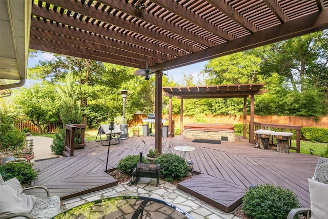 wooden deck featuring a pergola and a jacuzzi