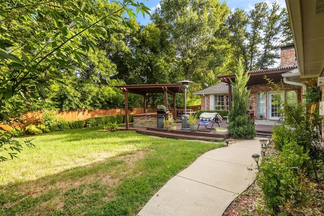 view of yard with a pergola and a deck