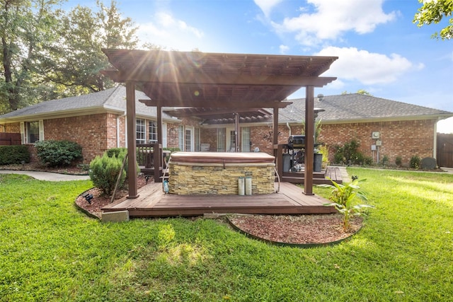 back of property featuring a yard, a deck, and a pergola