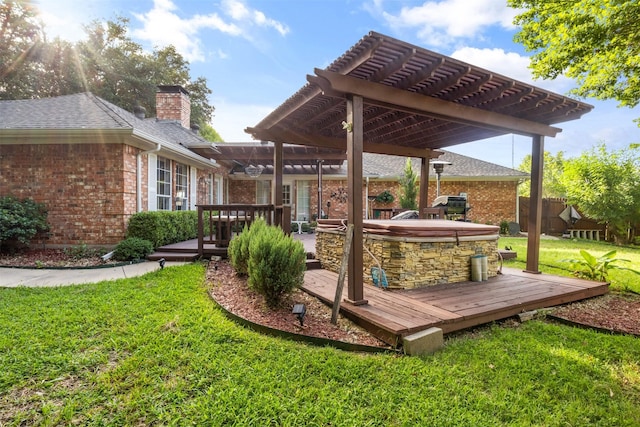 deck featuring a pergola and a lawn