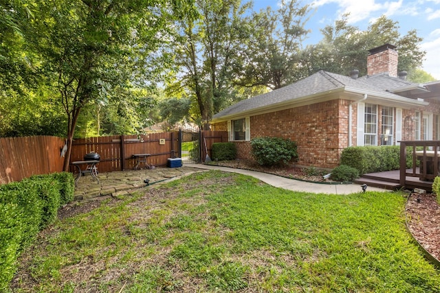 view of yard featuring a wooden deck