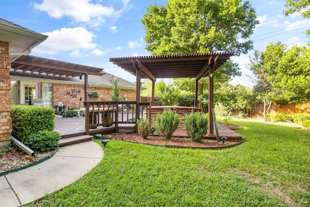 view of yard featuring a wooden deck and a pergola