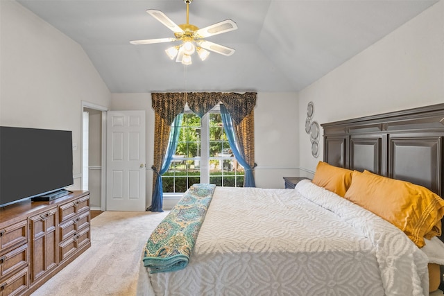 bedroom with vaulted ceiling, light carpet, and ceiling fan