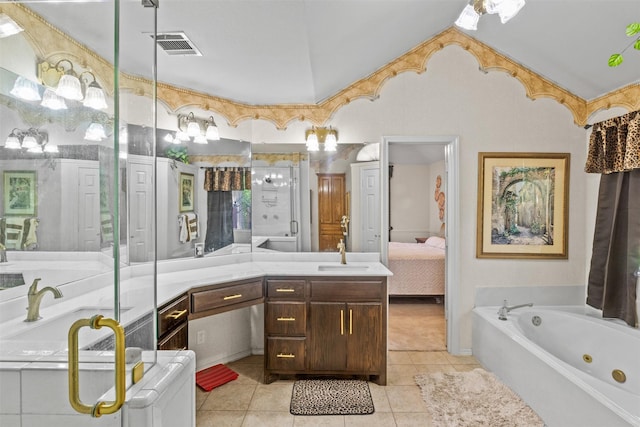 bathroom featuring tile patterned flooring, vanity, lofted ceiling, and a washtub