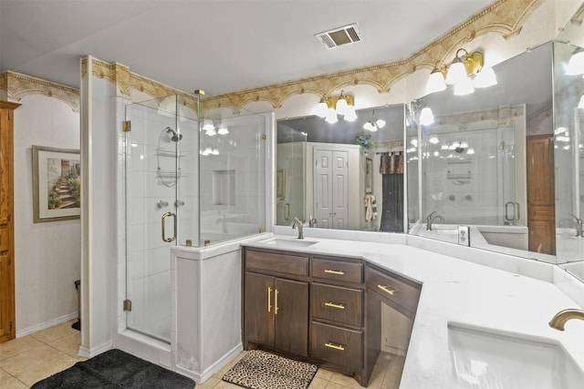 bathroom with vanity, tile patterned flooring, and walk in shower