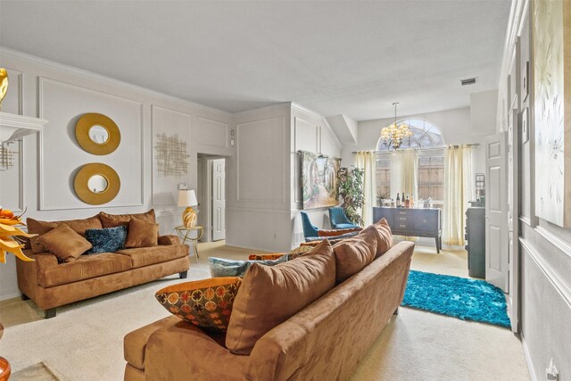 carpeted living room with a chandelier