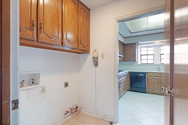 interior space with light tile patterned floors, black dishwasher, and sink