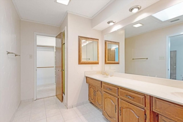 bathroom with vanity, an enclosed shower, and crown molding