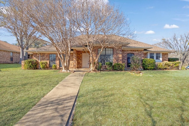 single story home featuring a front yard