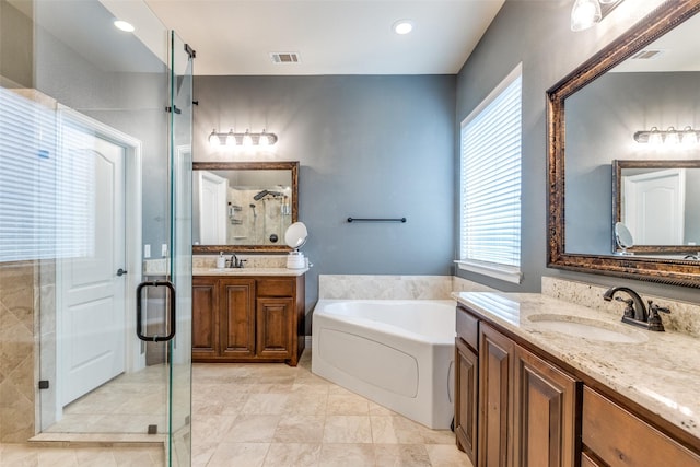 bathroom with plus walk in shower and vanity