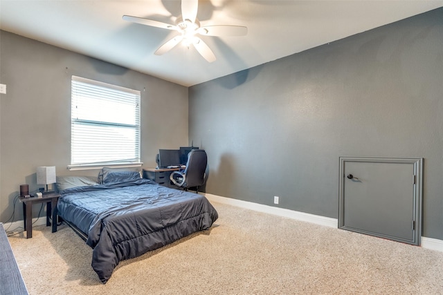 bedroom with ceiling fan and light carpet