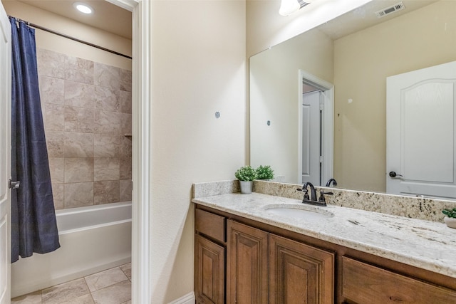 bathroom with shower / bathtub combination with curtain, tile patterned floors, and vanity