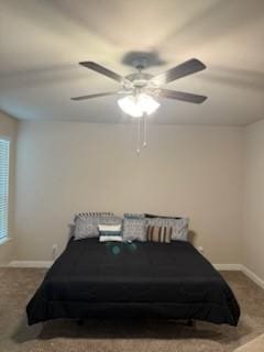 bedroom with ceiling fan and carpet