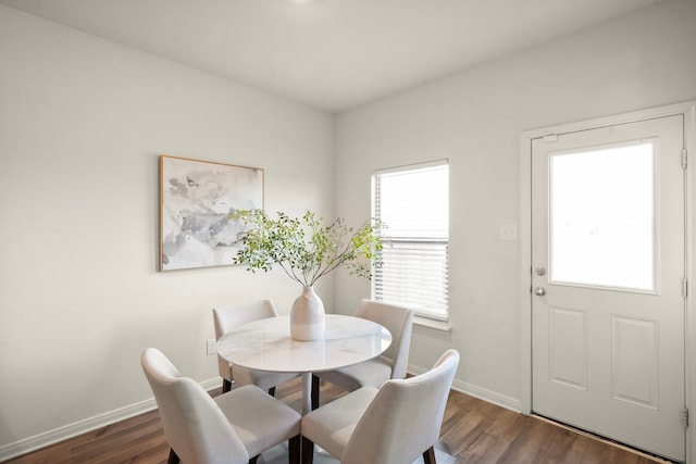 dining area with dark hardwood / wood-style floors