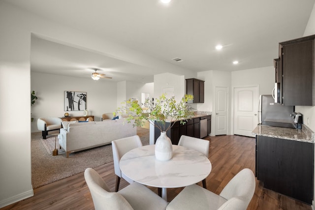 dining room featuring dark hardwood / wood-style floors and ceiling fan