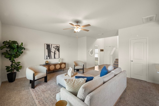 living room with carpet flooring and ceiling fan