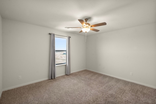 carpeted empty room with ceiling fan