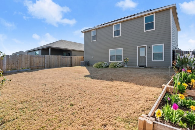 rear view of property featuring central AC unit