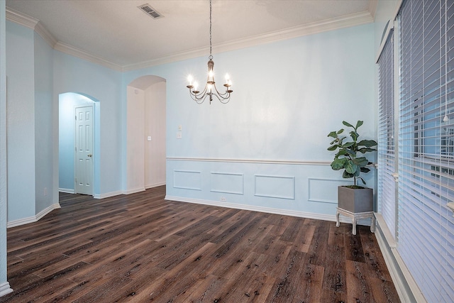 unfurnished dining area with crown molding, a chandelier, and dark hardwood / wood-style floors