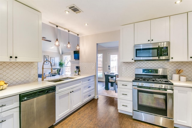 kitchen featuring sink, white cabinetry, and stainless steel appliances