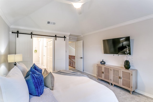 carpeted bedroom featuring ceiling fan, a barn door, and crown molding