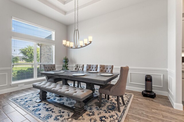 dining space with a chandelier and hardwood / wood-style flooring