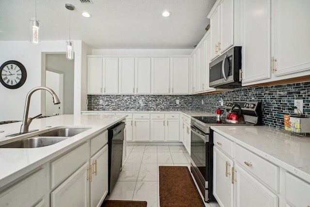 kitchen featuring sink, white cabinets, pendant lighting, and appliances with stainless steel finishes