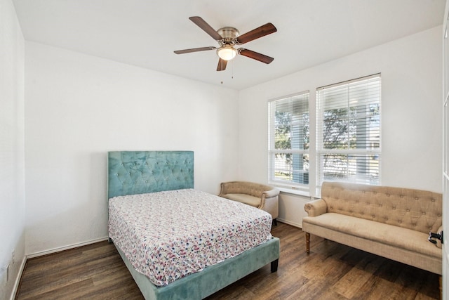 bedroom with ceiling fan and dark hardwood / wood-style flooring