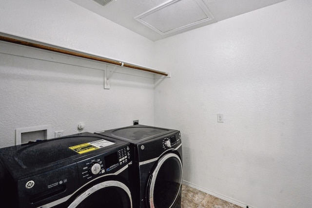 clothes washing area featuring washing machine and dryer