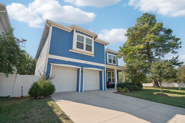 view of front of house featuring a front yard and a garage