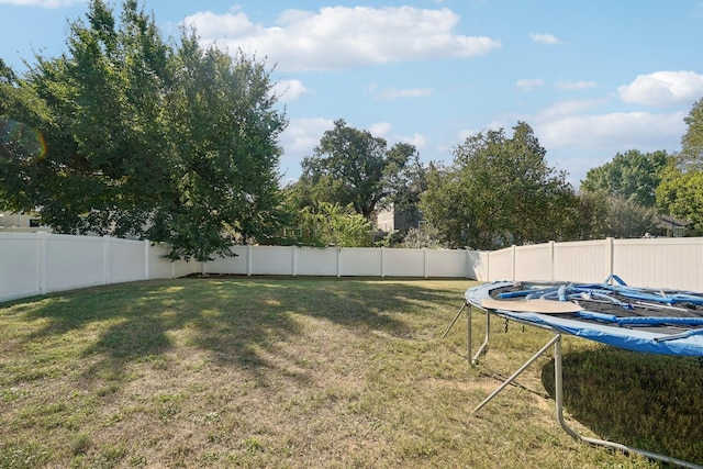 view of yard with a trampoline