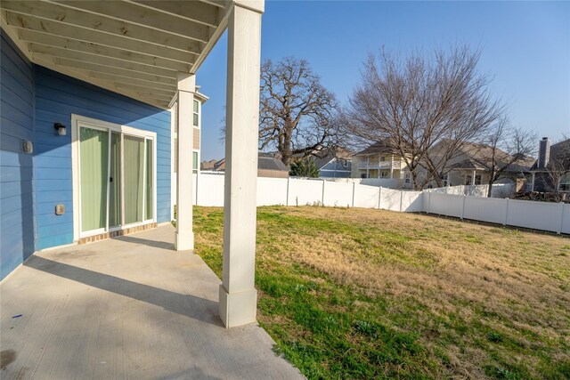 view of yard with a patio area and a fenced backyard