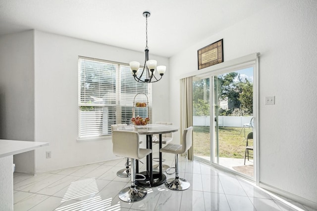 dining room with an inviting chandelier and a wealth of natural light