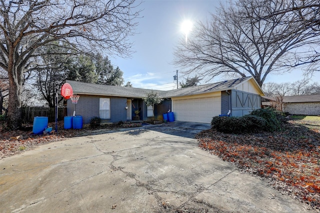 ranch-style house featuring a garage