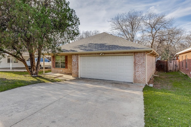 view of front of house with a front yard and a garage