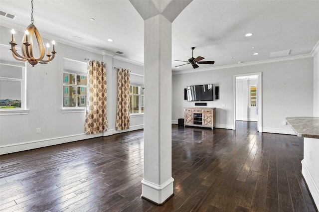 unfurnished living room featuring dark hardwood / wood-style floors, ceiling fan with notable chandelier, and ornamental molding