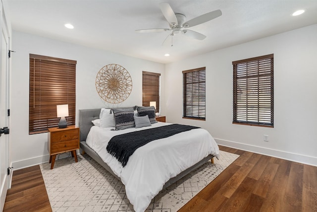 bedroom with ceiling fan and wood-type flooring