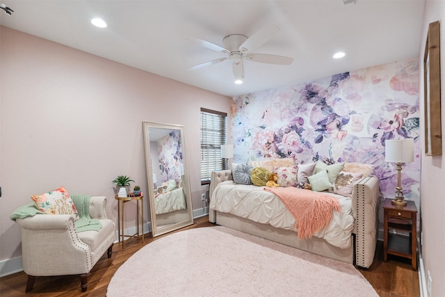 bedroom with ceiling fan and dark wood-type flooring